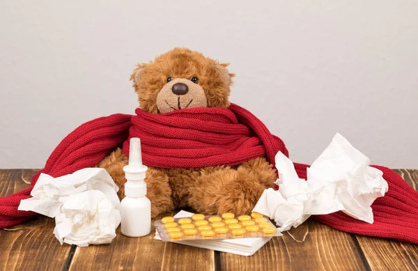 Fluffy Teddy Bear Nasal Spray Pills Red Scarf Tissues Wooden — Stock Photo, Image