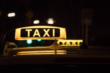 Two taxi in Germany at nigh
