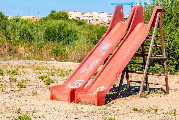 Two Dirty Red Slides Playground Majorca Spain — Stock Photo, Image