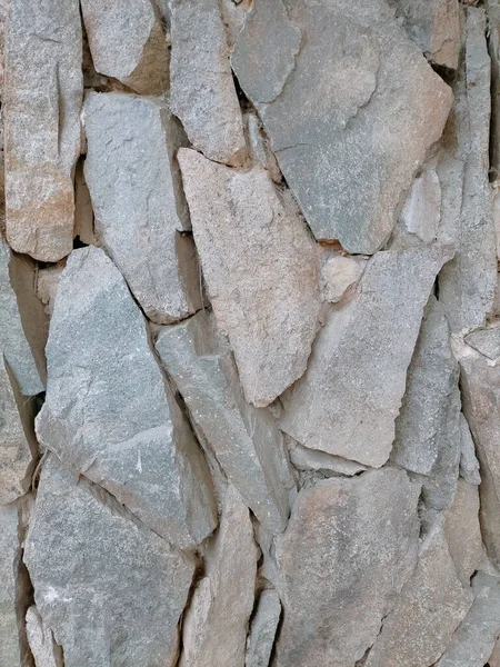 細長い色の石の壁のテクスチャのフルフレームショット — ストック写真