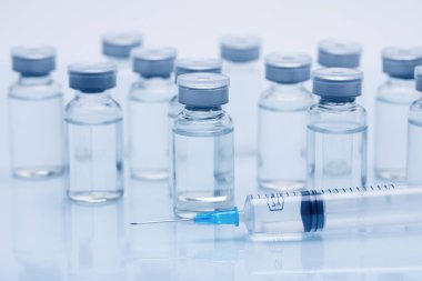 closeup view of ampoules for injection on white background