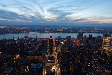 An aerial view of the modern skyscrapers in New York City during sunset
