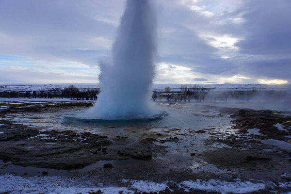 A beautiful shot of water in Geyser Iceland against cloudy sky at sunset
