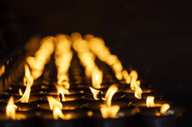 burning red candles at night. during religious holidays 