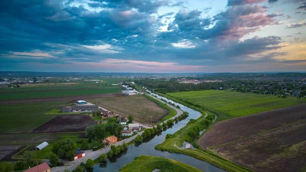 Aerial Shot Rural Houses River Surrounded Agricultural Fields Colorful Sky — Stock Photo, Image