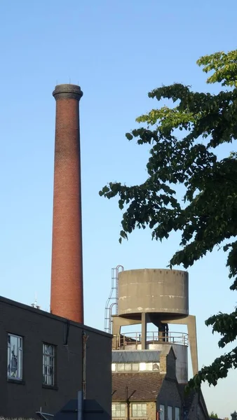 A building factory on a sunny day with a blue sky background