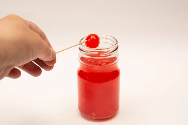 Hand Maraschino Cherry Cocktail Stick Being Taken Clear Glass Jar — Stock Photo, Image