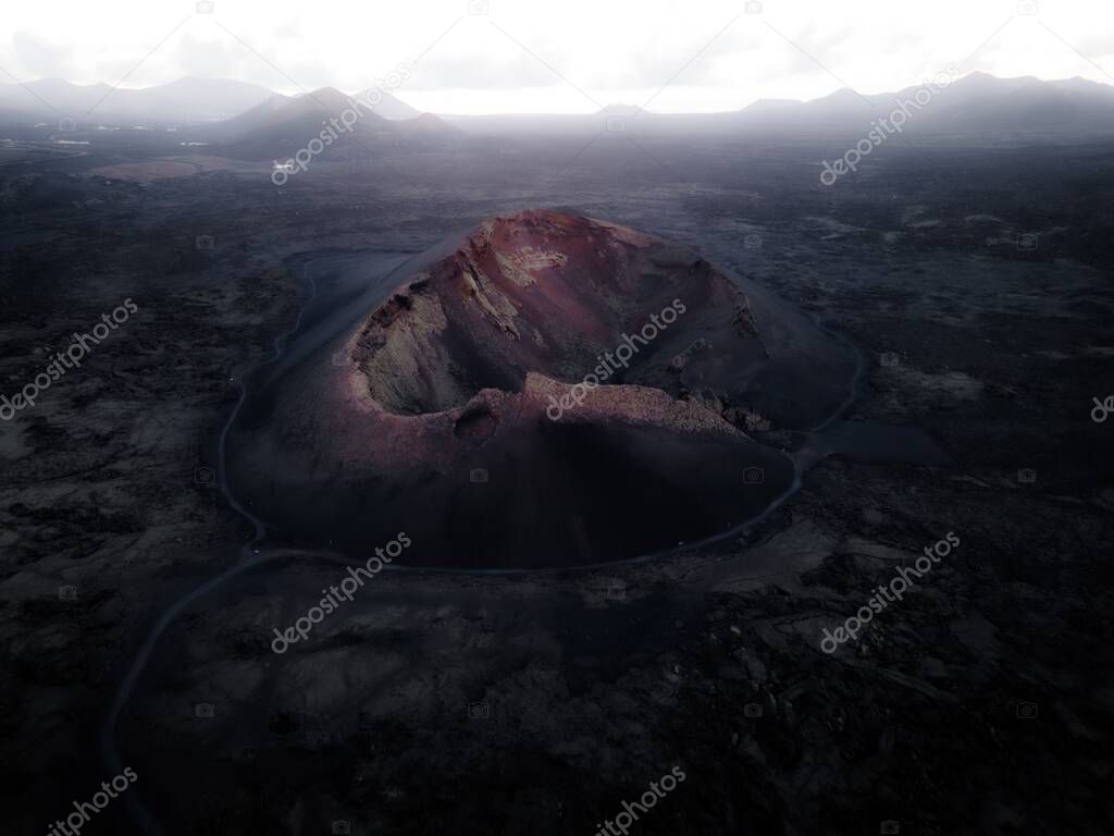 An aerial shot of Mauna Loa volcano in Hawaii with ashes in the  surroundings