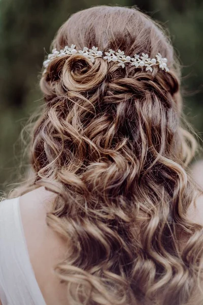 A bride with long beautiful curly hair