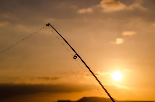 Рибалка Риболовля Род Силует Помаранчевому Заході Сонця — стокове фото