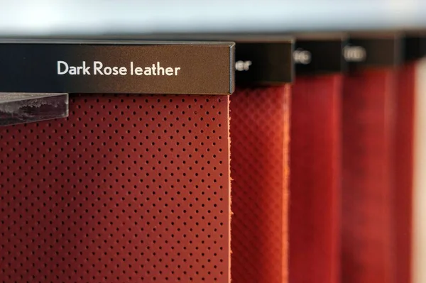 A selective focus shot of red sample catalog for red grades with text dark rose leather