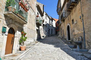 A narrow street between the old houses of Guardia Sanframondi, a village in the province of Benevento, Italy.