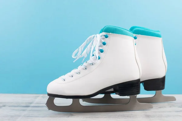 Pair Ice Skaters Front Blue Background Winter Sport Equipment — Stock Photo, Image