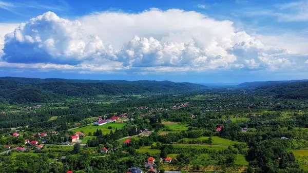Aerial View Rural Area Surrounded Trees Mountains Cloudy Sky Sunny — Stock Photo, Image