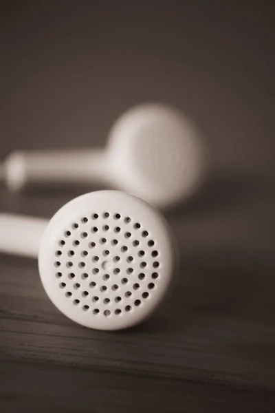 Selective Focus Shot White Wireless Earphones Wooden Table — Stock Photo, Image