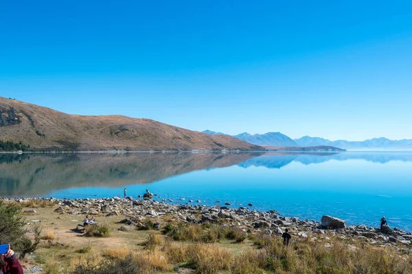 Μια Γραφική Θέα Της Πεντακάθαρης Λίμνης Tekapo Και Όμορφα Βουνά — Φωτογραφία Αρχείου