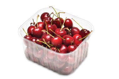 Cherries in plastic container isolated on white clipart