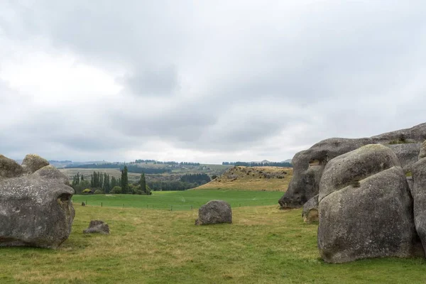A beautiful view of the field on a cloudy day in Elephant Rocks, South Island, New Zealand
