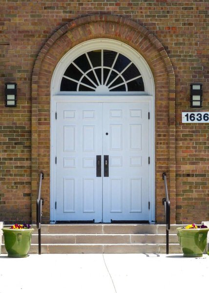 A white door in the entrance of the church