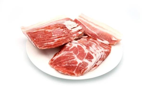 Closeup Bunch Raw Pork Slices Plate Plain Bright White Background — Stock Photo, Image