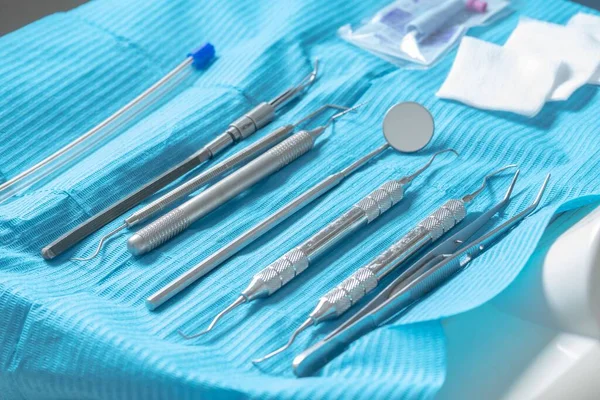 Closeup Shot Professional Dental Instruments Treatment Blue Surface — Stock Photo, Image