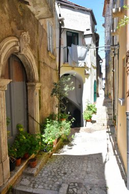 A narrow street between the old houses of Guardia Sanframondi, a village in the province of Benevento, Italy.