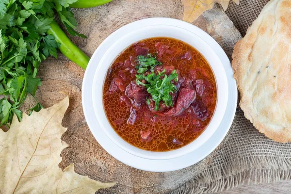 Meaty Hot Red Soup Bowl Bread Herbs Dried Leaf — Stock Photo, Image