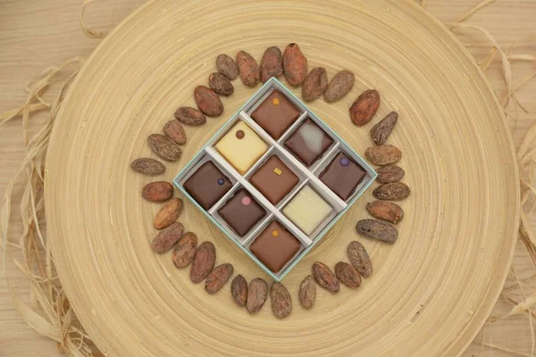 Top View Shot Box Square Gourmet Chocolates Different Toppings Surrounded — Stock Photo, Image