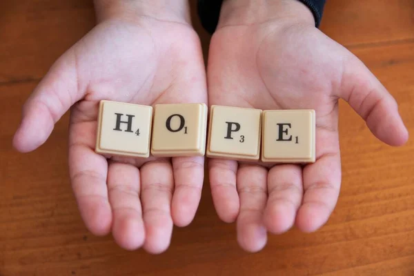 Closeup Hands Holding Plastic Letters Spelling Hope Concept Hope Live — Stock Photo, Image