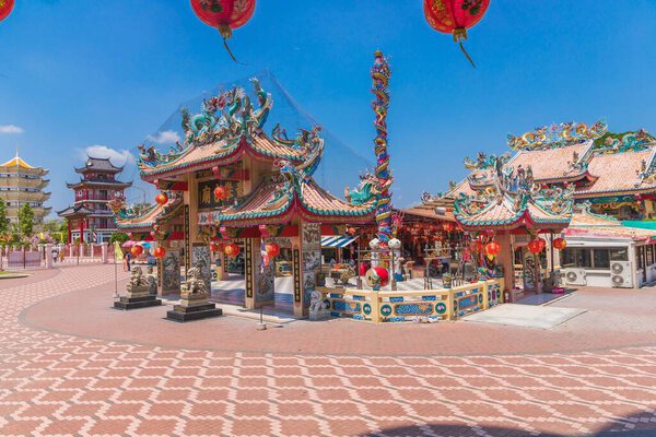 A beautiful view of the Buddhist temple with a garden in Suphan Buri, Thailand