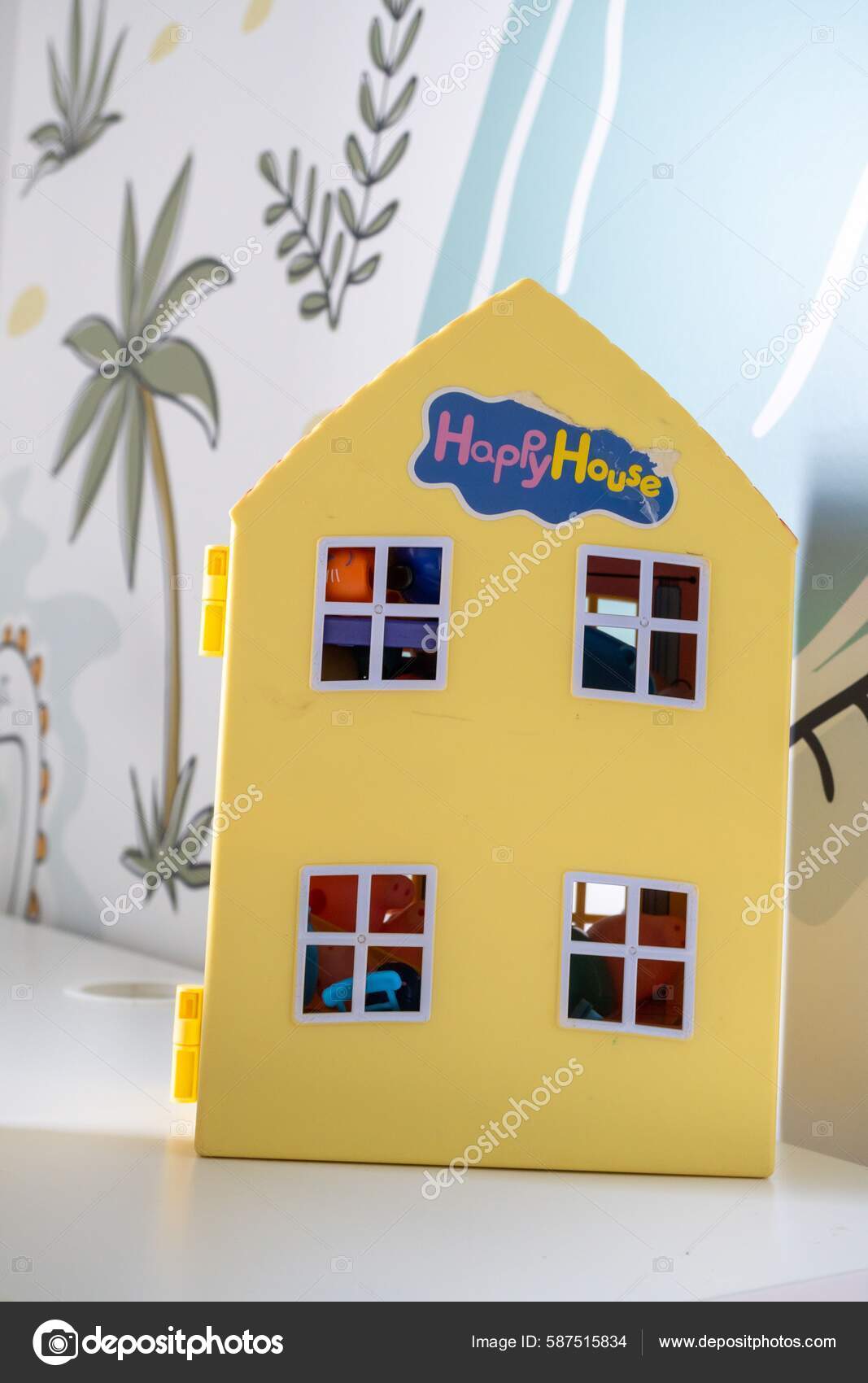 A plastic Peppa Pig toy play house standing on a table Stock Photo