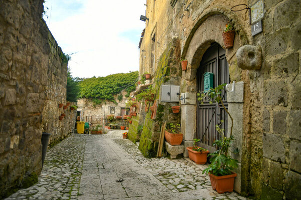 A narrow street among the old stone houses of the oldest district of the city of Caserta