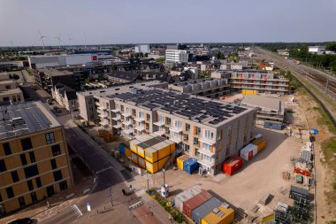 Construction site Ubuntuplein in urban development of real estate investment project in new Noorderhaven neighbourhood. clipart