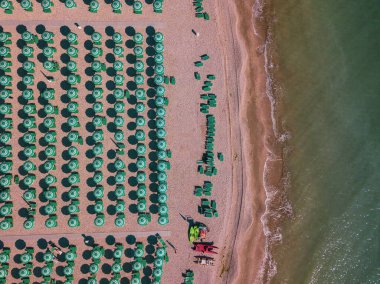 aerial view of fano with its sea, beaches and umbrellas clipart