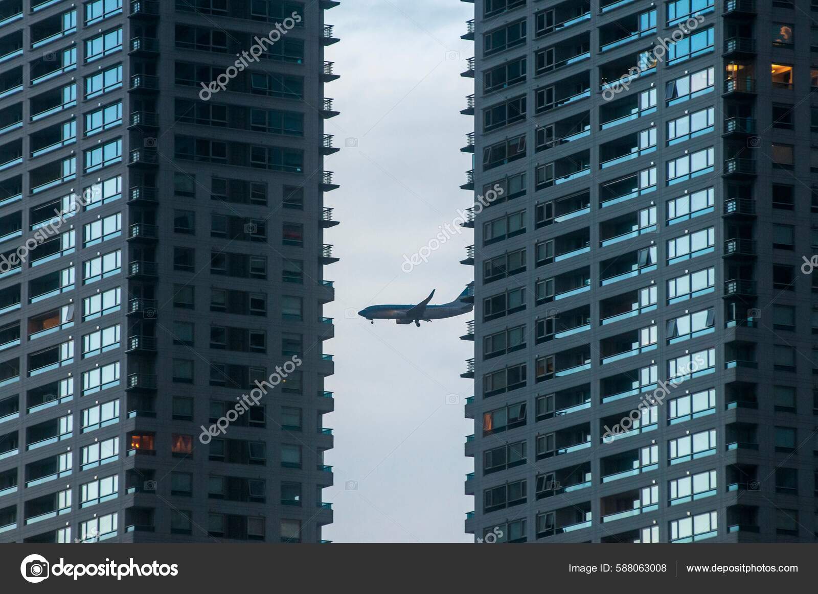 Plane Flight Seen Two Buildings Evening — Stock Editorial Photo ©  wirestock_creators #588063008, image size:1600x1163