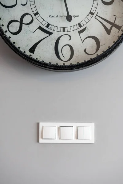 Vertical Shot Large Clock Wall White Light Switches — Stock Photo, Image