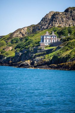 A detached house on the cliffs of Howth, Ireland. clipart