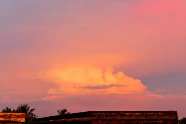 Dramatic colorful cloud formation in the sky during sunset in Indian monsoon