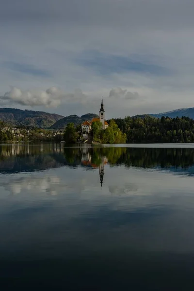 Vertical Shot Bled Island Church Reflected Water — стоковое фото