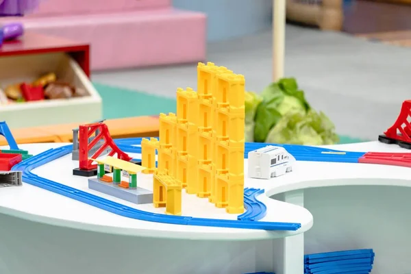 A plastic Peppa Pig toy play house standing on a table Stock Photo