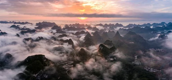 A beautiful view of the forested mountains in the mist