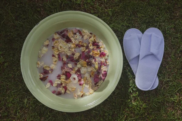 Top View Rose Petals Essential Oils Tub Next White Flippers — Stock Photo, Image