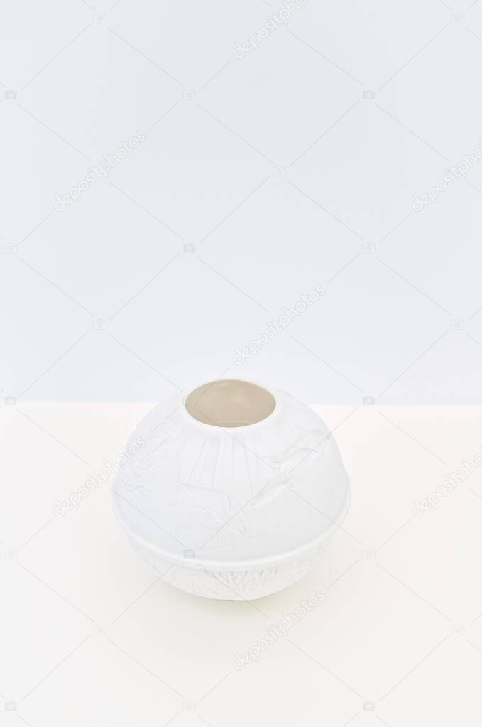 cozy white porcelain table lantern on a desk with copy space