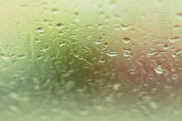 Ein Hintergrund Mit Regentropfen Auf Der Autoscheibe — Stockfoto