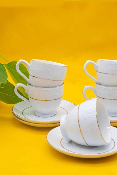 White Porcelain Tea Cup Golden Line Decoration Yellow Colour Background — Stock Photo, Image