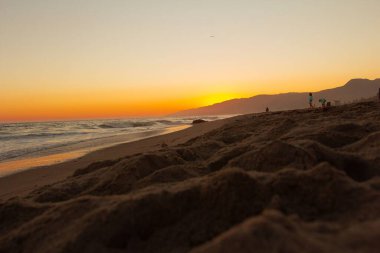 Kaliforniya 'da Zuma Sahili' nde güzel bir gün batımı