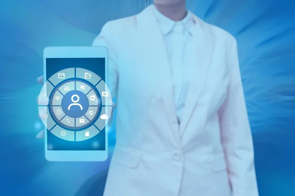 A female with a suit holding a Screen Of Mobile Phone and Showing The Futuristic Technology
