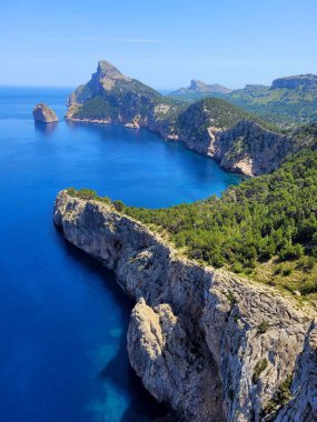 A beautiful view of the sea near the mountains on a sunny day