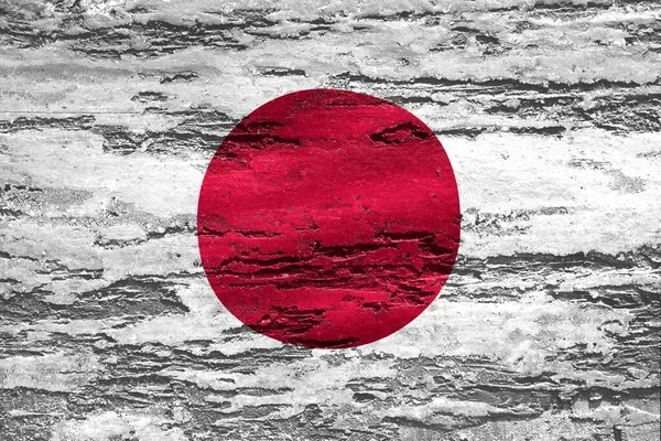 A Japan flag printed on a textured chipping wood background