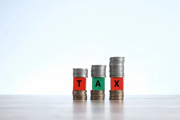 Words Tax Written Wooden Blocks Sandwiched Stacks Coins — Stock Photo, Image